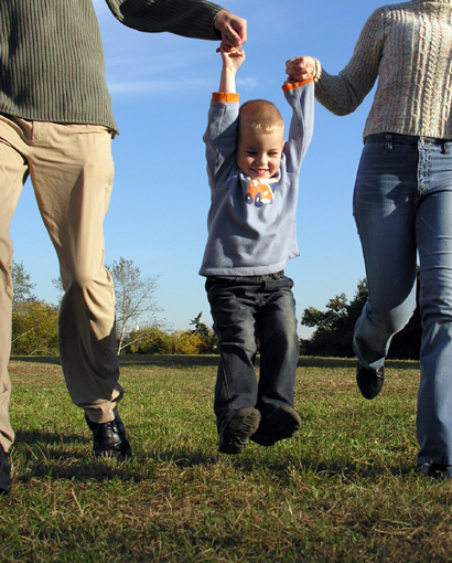 Photo of a family walking and smiling